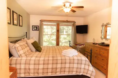 a bedroom with a bed and a ceiling fan at Camelback Private Home located behind Waterpark & Ski Lift in Tannersville
