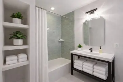 a white bathroom with a sink and a shower at Artsy Hidden Gem --- FREE PARKING in Philadelphia