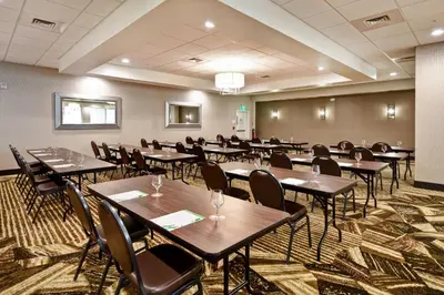 a classroom with tables and chairs in a room at Holiday Inn Lancaster by IHG in Lancaster