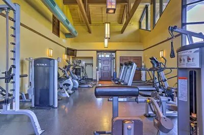 a gym with several treadmills and cardio machines at Excellent Lakeview Getaway with Watercrafts Included in Pocono Lake