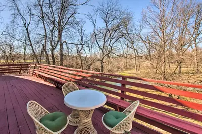 a table and chairs sitting on a wooden bench at Creek Access and Deck Runningwater Lancaster Gem in Lancaster