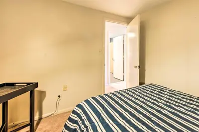 a bedroom with a bed and a desk and a window at Creek Access and Deck Runningwater Lancaster Gem in Lancaster
