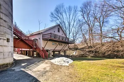 a large house with a porch and stairs on it at Creek Access and Deck Runningwater Lancaster Gem in Lancaster