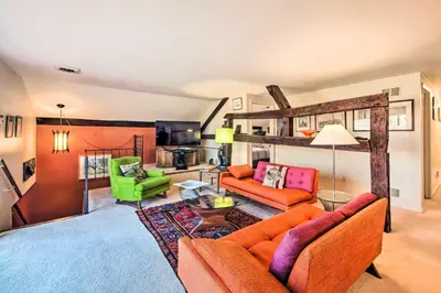 a living room with orange furniture and green chairs at Creek Access and Deck Runningwater Lancaster Gem in Lancaster