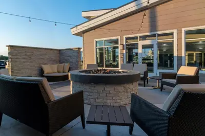 a patio with chairs and a fire pit at Residence Inn by Marriott Wilkes-Barre Arena in Wilkes-Barre