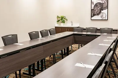 a conference room with a long table and chairs at Residence Inn by Marriott Wilkes-Barre Arena in Wilkes-Barre
