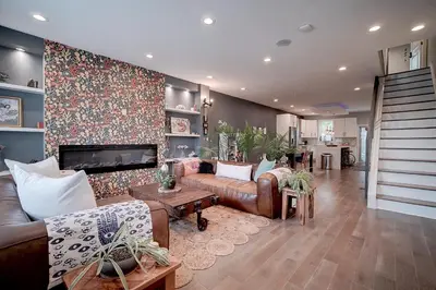 a living room with a couch and a fireplace at Artsy Hidden Gem ll -Free Parking -- in Philadelphia