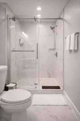 a white bathroom with a shower and a toilet at Artsy Hidden Gem ll -Free Parking --- in Philadelphia