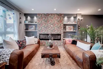 a living room with a couch and a fireplace at Artsy Hidden Gem ll -Free Parking --- in Philadelphia