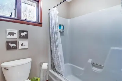 a bathroom with a toilet and a shower at Lake Access and Private Hot Tub at Poconos Home! in White Haven