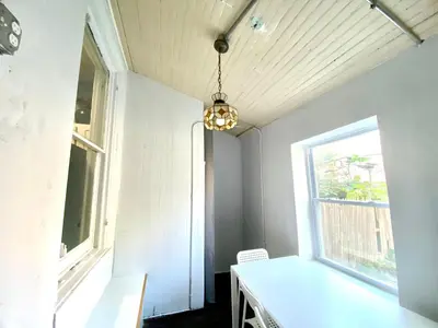 a room with a white table and a window at Legacy - Spring Garden University City in Philadelphia