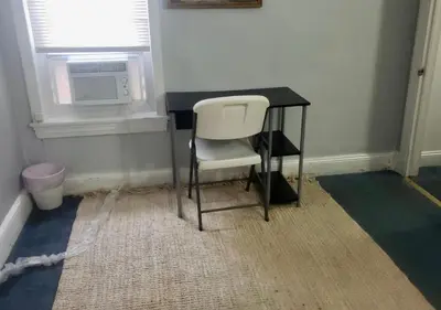 a white chair sitting at a desk in a room at Oui on Ludlow - Entire House and Private Rooms in University City in Philadelphia