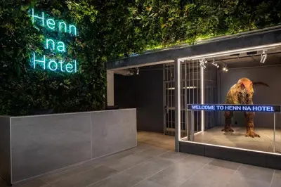 a bird in a cage in a display case at Henn na Hotel New York in New York