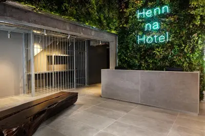a room with a bird cage in front of a building at Henn na Hotel New York in New York