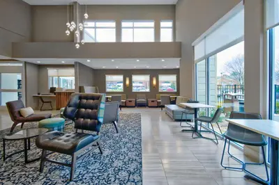 a lobby of a hospital with chairs and tables at Residence Inn by Marriott Reading in Wyomissing