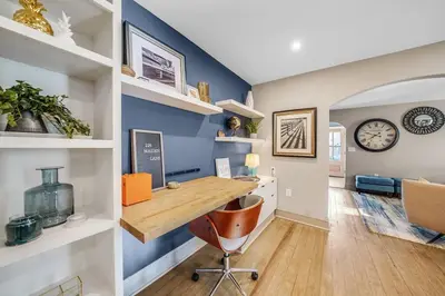a home office with a desk and a chair at Luxury Apartment in Historic Carriage House in Kennett Square