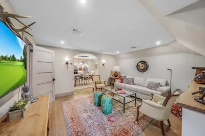 a living room with a couch and a table at Luxury Loft in Historic Carriage House in Kennett Square