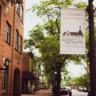 a sign for a kent kent square on a street at Luxury Loft in Historic Carriage House in Kennett Square