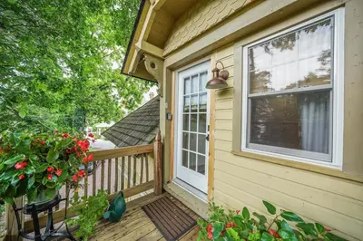 a front porch of a house with a window at Luxury Loft in Historic Carriage House in Kennett Square