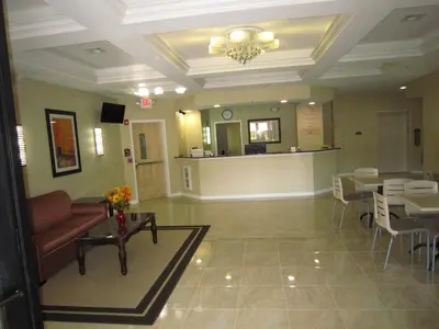 a lobby of a hospital with a waiting room at Red Carpet Inn and Suites Monmouth Junction in Monmouth Junction