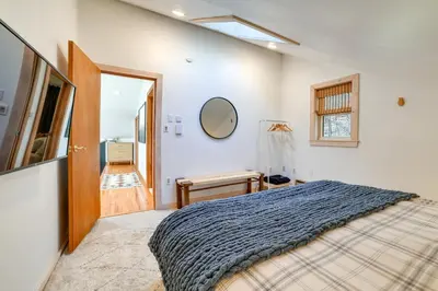 a bedroom with a bed and a mirror on the wall at Hilltop Walton Getaway with Picturesque Views! in Walton