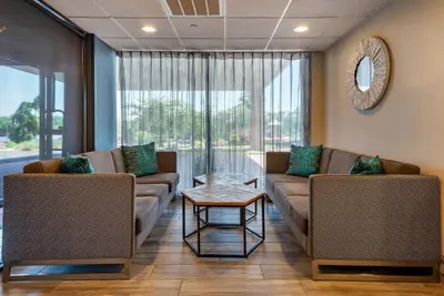 a living room with two couches and a table at MainStay Suites Horsham - Philadelphia in Horsham