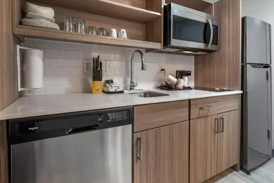 a kitchen with a sink and a dishwasher at MainStay Suites Horsham - Philadelphia in Horsham