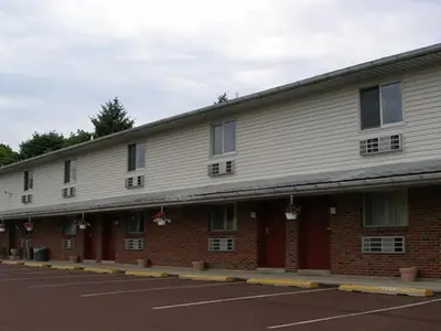 a building with a parking lot in front of it at Knights Inn Center Valley in Center Valley