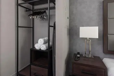 a room with a closet with a lamp and towels at Residence Inn by Marriott Orangeburg in Orangeburg