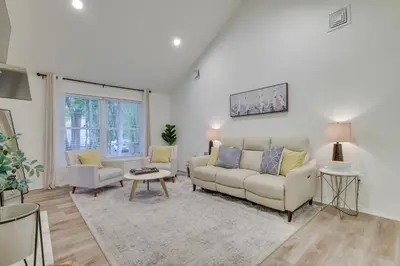 a living room with a couch and two chairs at 7 Mi to Camelback Mtn Chic Penn Estates Home in East Stroudsburg