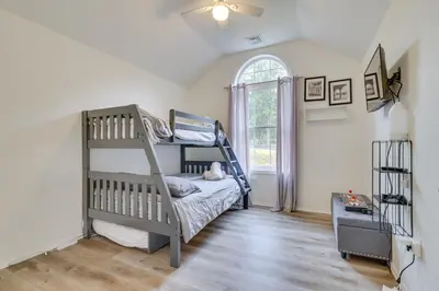 a bedroom with two bunk beds and a window at 7 Mi to Camelback Mtn Chic Penn Estates Home in East Stroudsburg