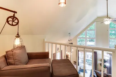 a living room with a couch and a chair at Furnished Deck and Fire Pit Poconos Outdoorsy Gem in Albrightsville