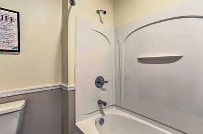 a bathroom with a shower and a bath tub at New ! Slopeside Townhome : WFH, Ski, Dine & Hike in Tannersville