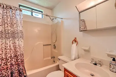 a bathroom with a sink and a toilet and a shower at 7 Mi to Big Boulder Mountain Poconos Escape! in Albrightsville