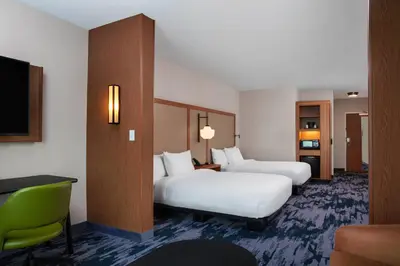a hotel room with two beds and a flat screen tv at Fairfield by Marriott Inn & Suites Lebanon Near Expo Center in Lebanon