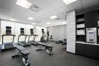 a gym with several treadmills and exercise bikes in it at Fairfield by Marriott Inn & Suites Lebanon Near Expo Center in Lebanon
