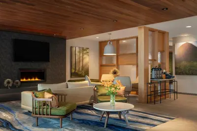 a living room with a couch and a fireplace at Fairfield by Marriott Inn & Suites Lebanon Near Expo Center in Lebanon