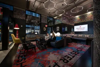 a rendering of the lobby of a restaurant with a bar at Pestana CR7 Times Square in New York