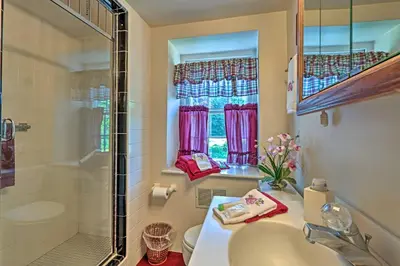 a bathroom with a sink and a shower at Pool and Courtyard Timeless Home in Lansdale in Lansdale
