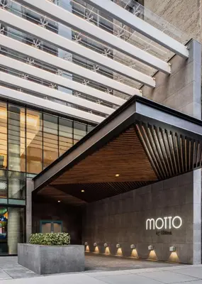 a building with a moto sign in front of it at Motto by Hilton New York City Chelsea in New York