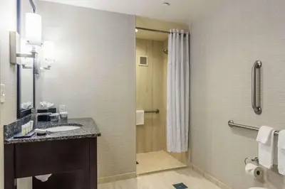a bathroom with a sink and a shower at Embassy Suites by Hilton Newark Airport in Elizabeth