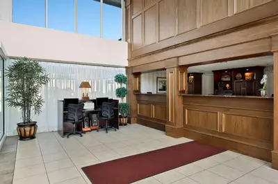 an office lobby with a desk at Brandywine Valley Inn SureStay Plus by Best Western in Wilmington