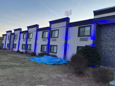 a row of buildings with blue lights on them at The Wayne Inn in Wayne