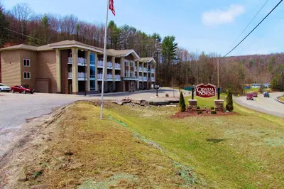 a building on the side of a road with a stop sign at Crystal Springs Inn and Suites in Towanda