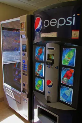a pepsi video game machine in a room at Crystal Springs Inn and Suites in Towanda