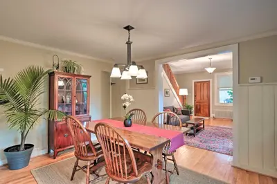a dining room with a table and chairs at Charming Abode with Patio - Walk to Town and River! in Stockton