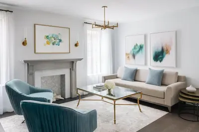 a living room with a couch and a table at The Wallace Hotel in New York