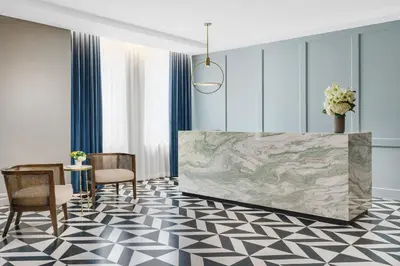 a rendering of a lobby with a map on the wall at The Wallace Hotel in New York