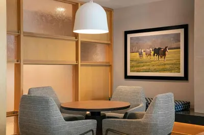 a meeting room with a table and chairs and a picture at Fairfield by Marriott Inn & Suites Lewisburg in Lewisburg