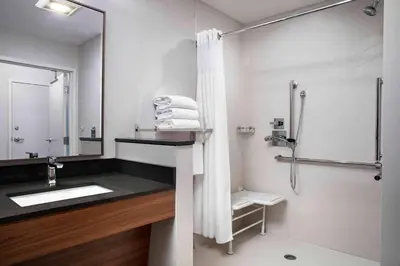 a bathroom with a sink and a shower at Fairfield by Marriott Inn & Suites Lewisburg in Lewisburg